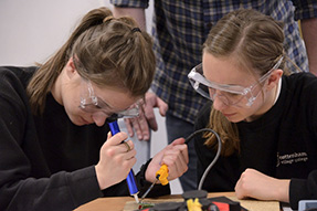 Read more about DOT Two secondary school girls with protective glasses are soldering